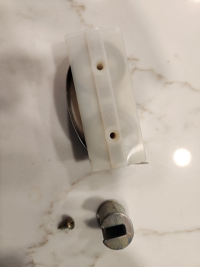 front of spring coil and pivot